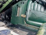 a close up of the inside of a green car