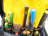 a backpack with tools in it that is full of tools