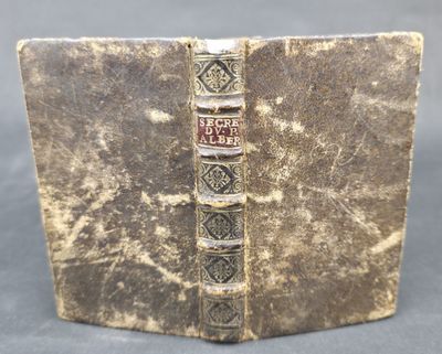 an old book with a bookmark on the front and a bookmark on the back