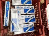 boxes of toothbrushes and toothpaste are on display in a store