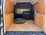 a van that has a tire in the back of it