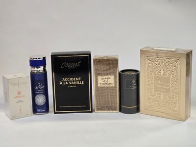 several different types of perfumes and boxes on a white surface