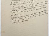a piece of paper with writing on it sitting on top of a table
