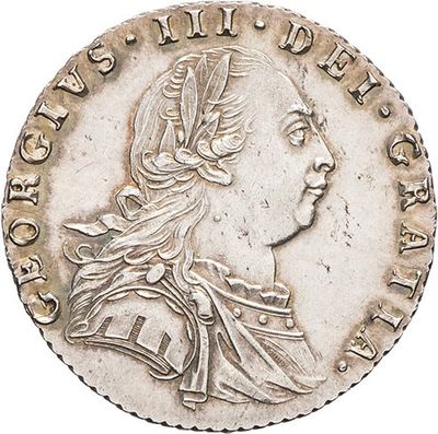 a silver coin with an image of a woman in profile