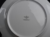 a white plate with a black writing on it