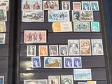 a lot of stamps on display in a display case