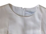 the back of a white dress with a zippered neckline