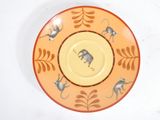 a yellow plate with a picture of a monkey on it