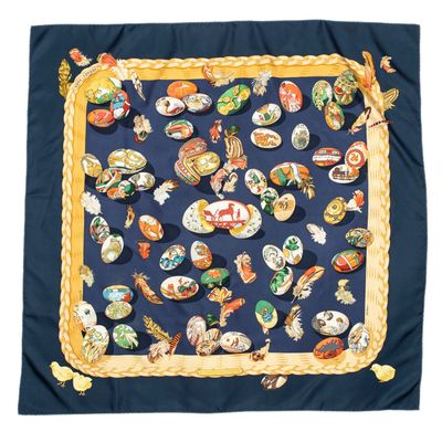 an image of a blue scarf with a picture of a bunch of birds on it