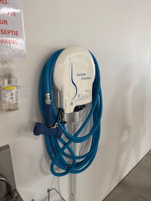 an electric charger attached to a wall in a garage