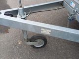 a trailer with a trailer attached to it in a parking lot
