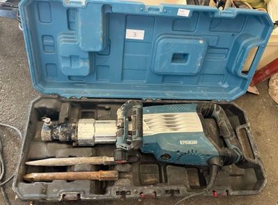 a blue tool case with tools in it on the floor