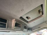 a view of a car ' s interior from the driver ' s seat