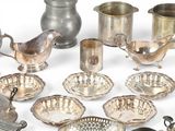 a lot of silver items that are on a table