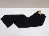 a pair of black jeans sitting on top of a white table