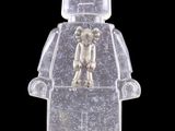 a lego man with a teddy bear on it ' s back