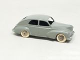 a toy car that is sitting on a white surface