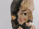 a statue of a man with a beard and a mustache
