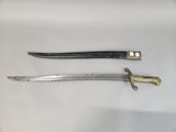 two knives are laying next to each other on a white surface