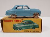 a blue toy car sitting on top of a box