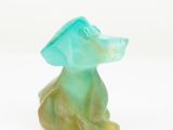 an image of a green dog figurine on a white background
