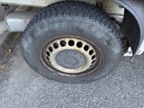 a close up of a flat tire on a truck