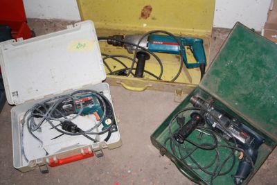 two tools in a case on the floor next to each other