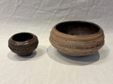 two bowls sitting next to each other on a table