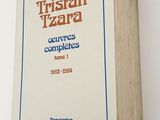 an image of a book on a white surface with a blue border