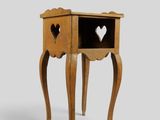 une petite table en bois dans laquelle un cœur a été découpé