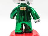 a toy elephant that is standing on a red base