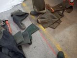 many pairs of boots that are laying on the floor