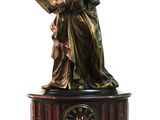 statue of a woman holding a book and a clock on top of a table