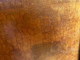 a close up of a wooden table with a clock on top of it