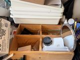 a wooden box filled with lots of crafting supplies