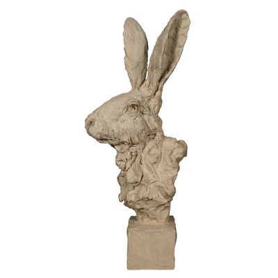 sculpture en marbre représentant une tête de lapin sur un socle