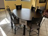 a table and chairs in the middle of a room