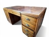 an image of a wooden desk with three drawers