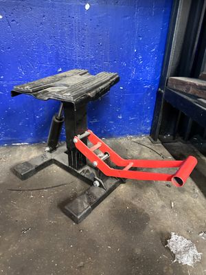 a red chair that is sitting in front of a blue wall