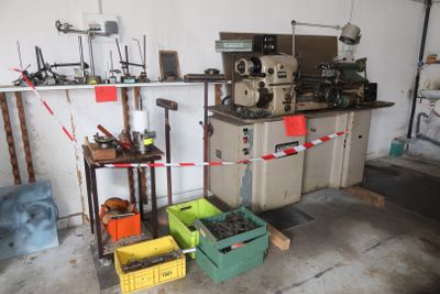 a room that has a bunch of tools on the shelves