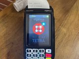 a cell phone sitting on a table with a receipt in front of it