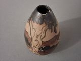 a small vase that is sitting on a table
