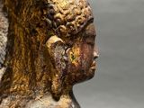 bronze statue of a woman with a bird on her head