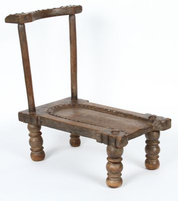 a small wooden bench with a wooden seat on it