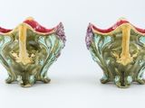 two vases that are sitting next to each other on a table