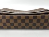 brown and black checkered purse on white background with white background