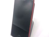 a cell phone that is sitting on top of a stand