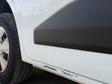 a white car parked on the side of the road