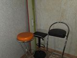 two stools and a table in a room