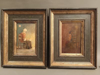 two framed paintings of a man sitting at a table and a woman sitting at a table